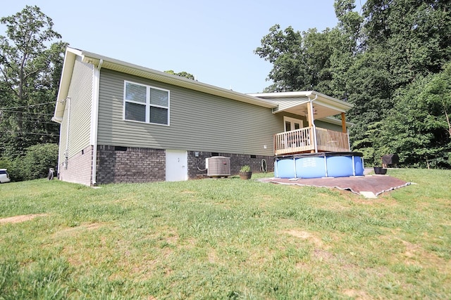 1161 Wooddale Rd, Morristown, TN 37814 - back of house with crawl space, a lawn, an outdoor pool, and central AC unit