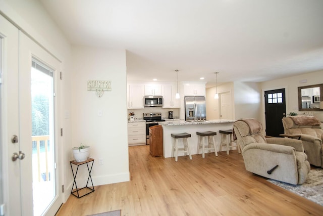 1161 Wooddale Rd, Morristown, TN 37814 - living room with light wood-style flooring, recessed lighting, and baseboards