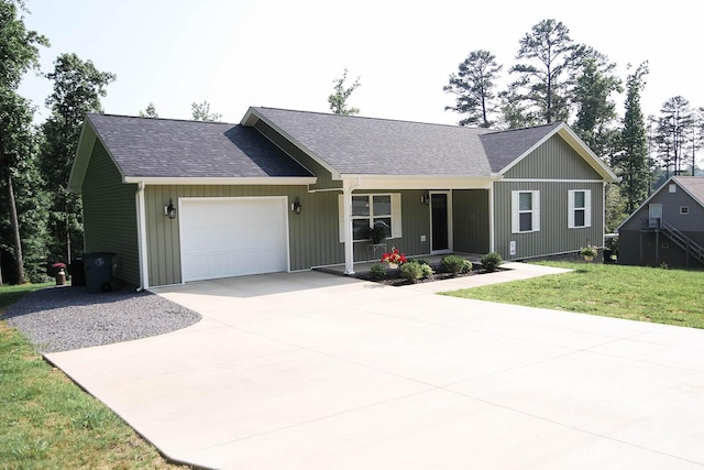 1161 Wooddale Rd, Morristown, TN 37814 - ranch-style home with a porch, driveway, a garage, and a shingled roof