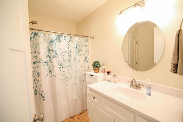 1161 Wooddale Rd, Morristown, TN 37814 - full bathroom with vanity, curtained shower, and wood finished floors