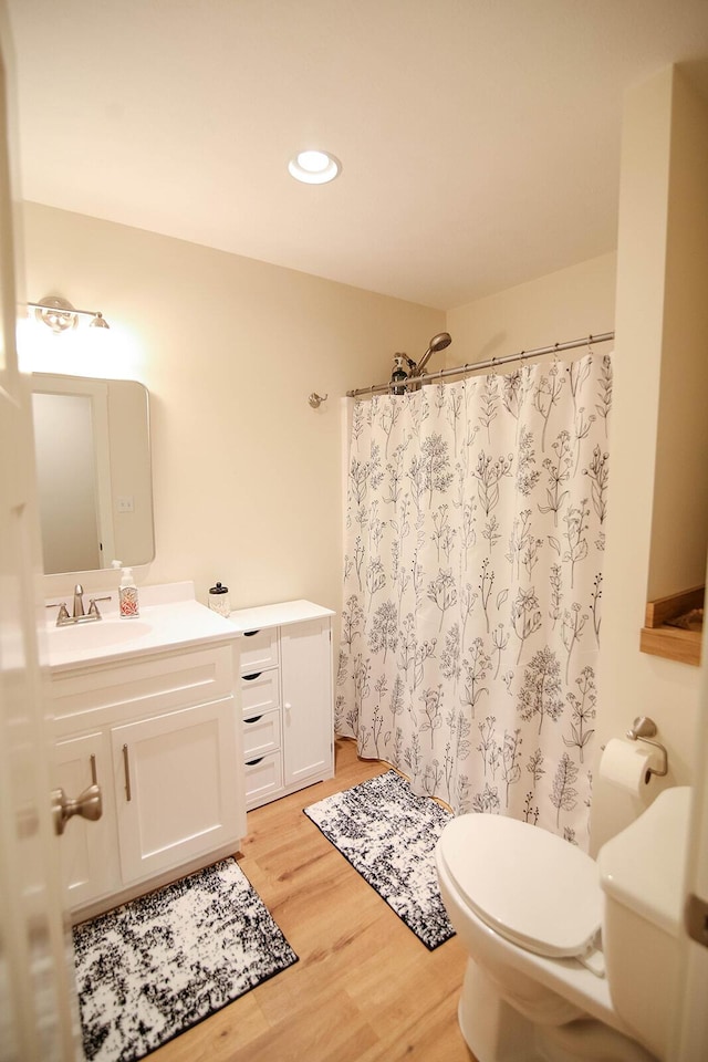 1161 Wooddale Rd, Morristown, TN 37814 - bathroom with toilet, vanity, wood finished floors, a shower with curtain, and recessed lighting