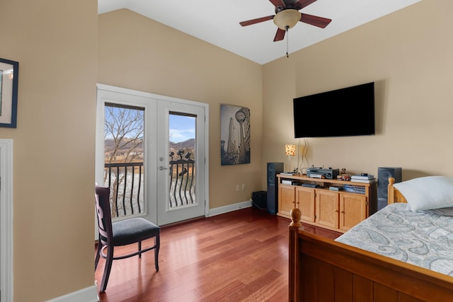 bedroom with vaulted ceiling, wood-type flooring, access to exterior, ceiling fan, and french doors