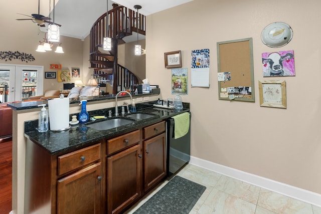 kitchen featuring pendant lighting, dishwasher, sink, kitchen peninsula, and french doors