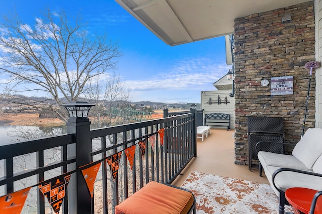 balcony featuring a water view