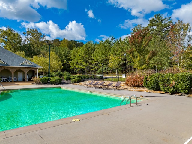 view of swimming pool featuring a patio