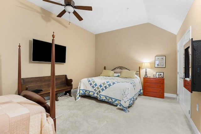 bedroom with ceiling fan, lofted ceiling, and light carpet