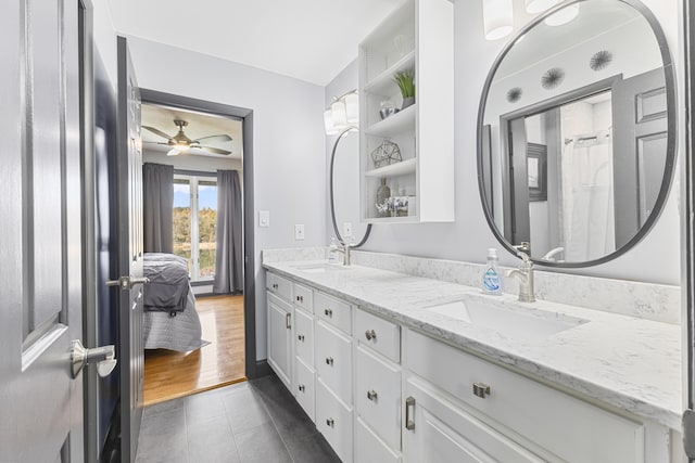 bathroom featuring hardwood / wood-style floors, vanity, and ceiling fan