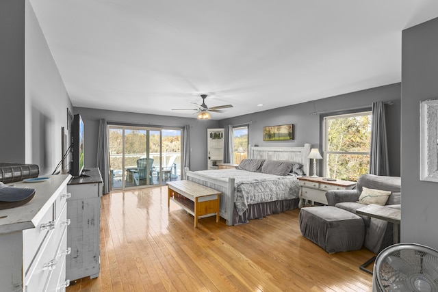 bedroom featuring ceiling fan, light hardwood / wood-style floors, and access to outside