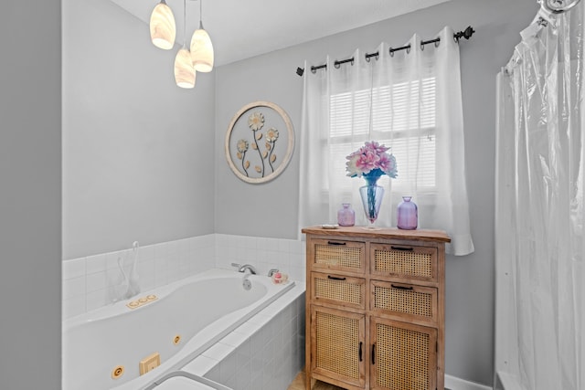 bathroom featuring a relaxing tiled tub