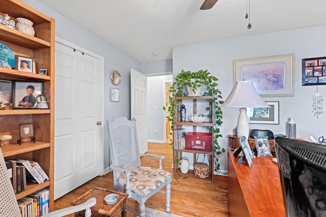 home office featuring hardwood / wood-style flooring and ceiling fan