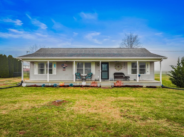 ranch-style house with covered porch and a front lawn