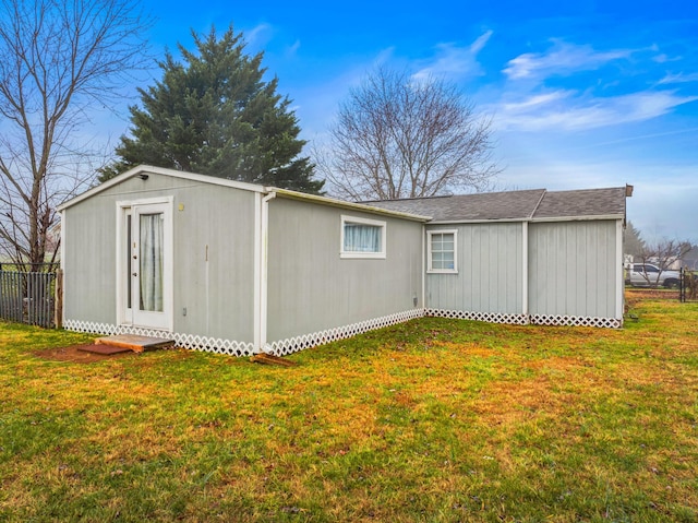 exterior space with a lawn and an outdoor structure