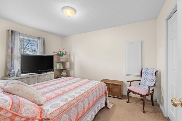 bedroom featuring light carpet