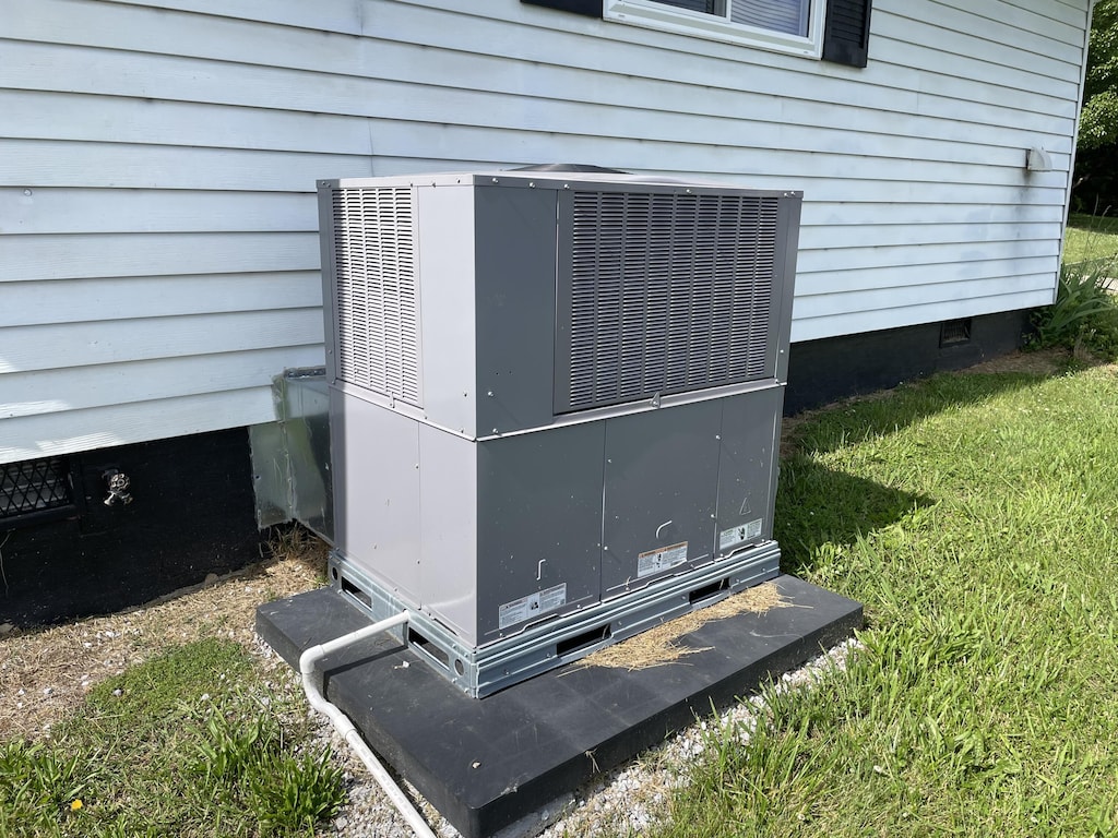 exterior view of crawl space and cooling unit