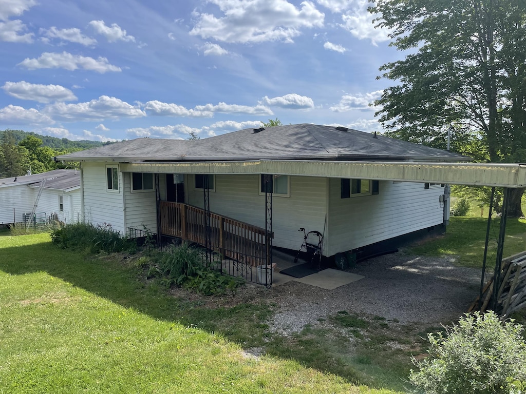 rear view of house with a yard