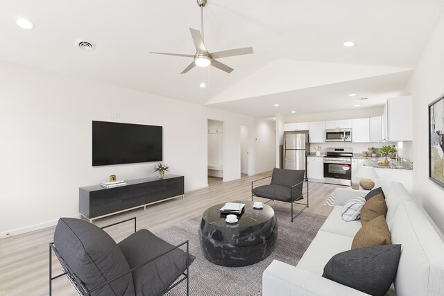 living room with lofted ceiling, visible vents, light wood-style floors, ceiling fan, and recessed lighting