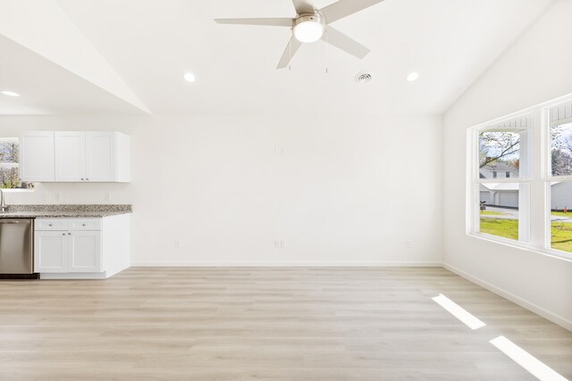 interior space featuring lofted ceiling, light wood-style flooring, and a ceiling fan