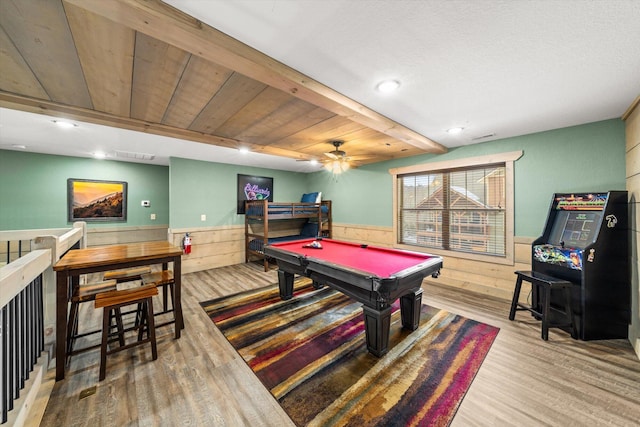 game room featuring wood ceiling, ceiling fan, hardwood / wood-style flooring, wood walls, and pool table