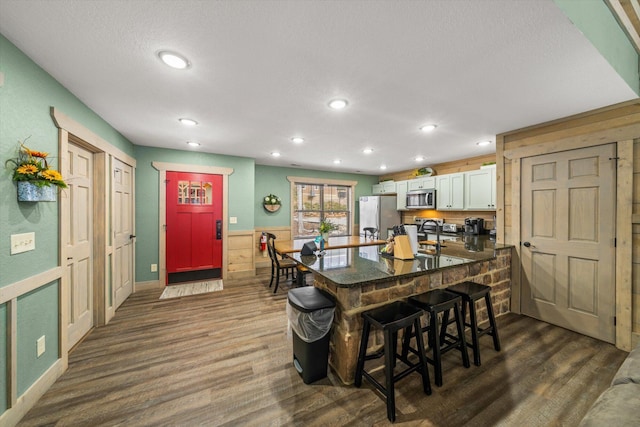 dining area featuring dark hardwood / wood-style flooring