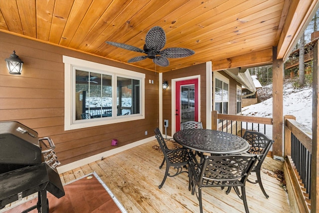 wooden deck featuring a grill and ceiling fan