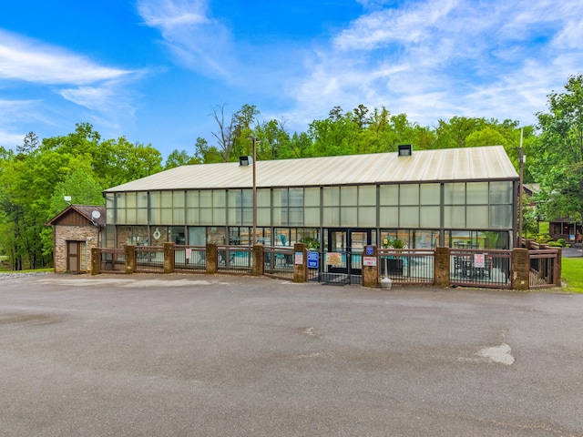 view of building exterior with fence