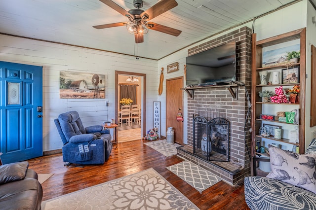 625 Trentham Hollow Rd, Parrottsville, TN 37843 - living room featuring wood-type flooring, a ceiling fan, a fireplace, wood walls, and wood ceiling