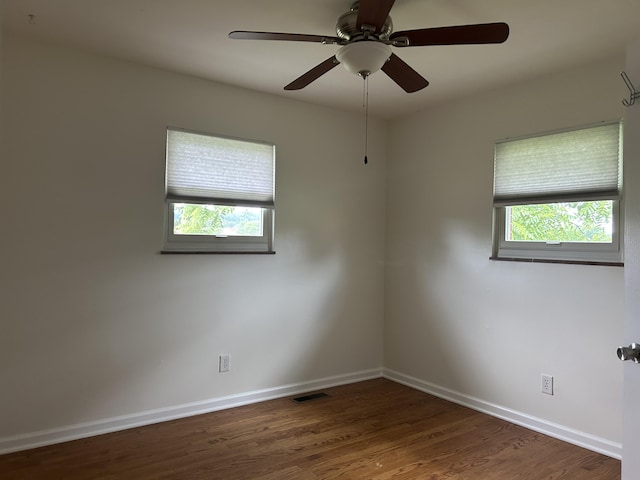 2151 Thomas Dr, Morristown, TN 37814 - empty room with healthy amount of natural light, wood finished floors, and a ceiling fan
