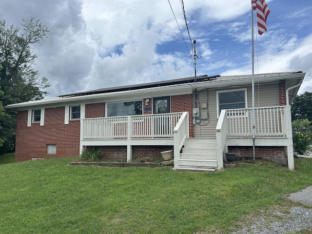 2151 Thomas Dr, Morristown, TN 37814 - rear view of property with a yard and roof mounted solar panels