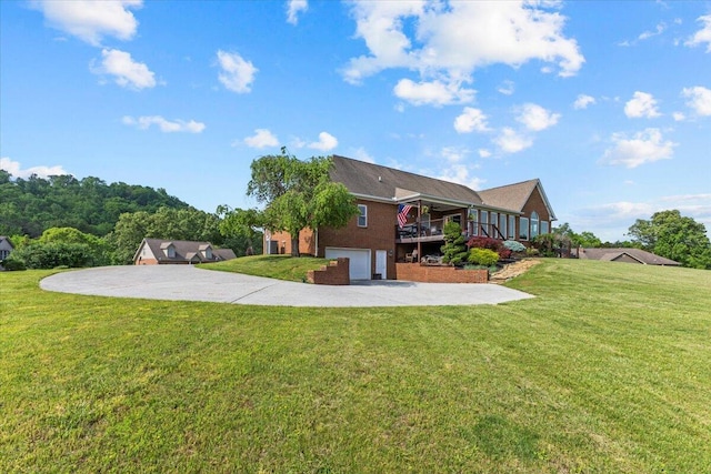 419 Colonial St, Jefferson City, TN 37760 - back of property featuring a garage, a lawn, and a wooden deck