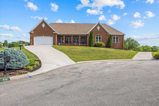 419 Colonial St, Jefferson City, TN 37760 - ranch-style house featuring brick siding, a front yard, an attached garage, and concrete driveway