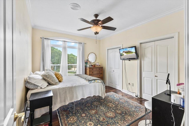 419 Colonial St, Jefferson City, TN 37760 - bedroom with dark wood-style floors, ornamental molding, multiple closets, ceiling fan, and baseboards