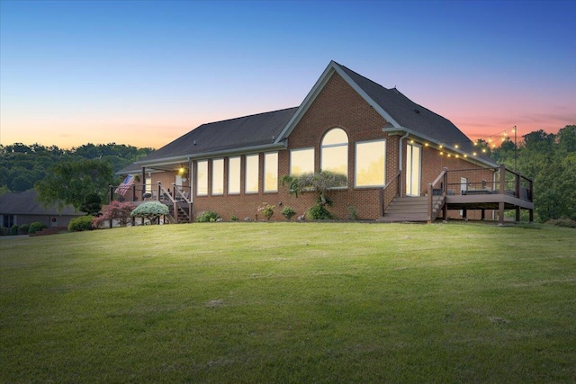 419 Colonial St, Jefferson City, TN 37760 - rear view of house featuring brick siding, a lawn, and a deck