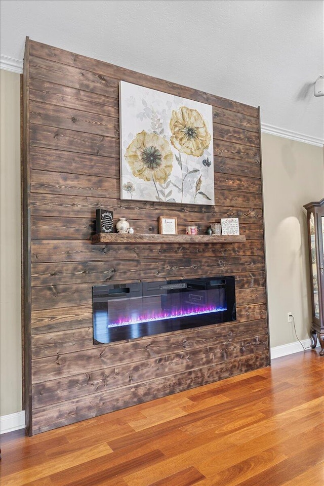 419 Colonial St, Jefferson City, TN 37760 - detailed view of a large fireplace, ornamental molding, wood finished floors, and baseboards