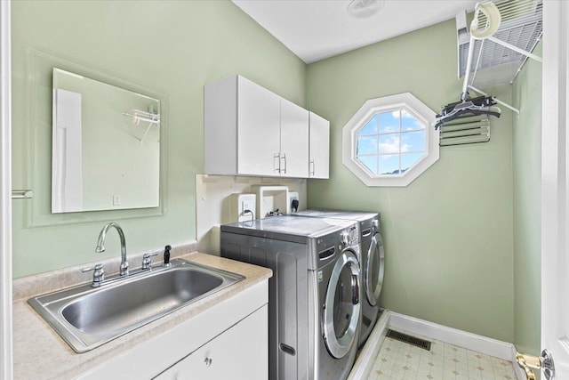 419 Colonial St, Jefferson City, TN 37760 - clothes washing area featuring washing machine and clothes dryer, tile patterned floors, cabinet space, and baseboards