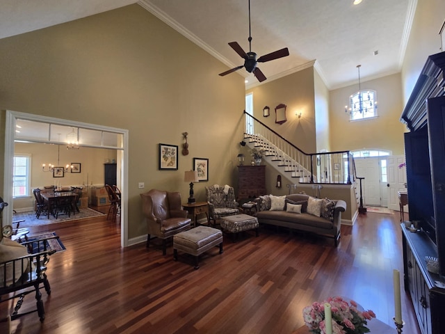 living area with stairs, dark wood-style floors, and high vaulted ceiling