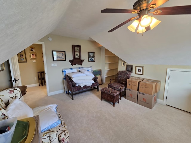 bedroom with baseboards, ceiling fan, carpet flooring, and lofted ceiling