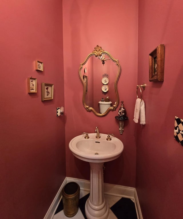 bathroom with baseboards