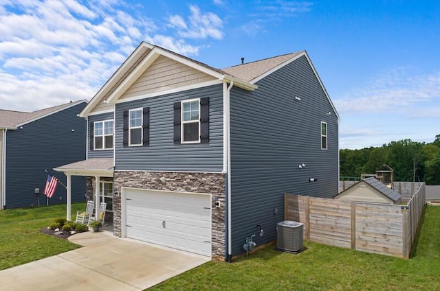 525 Cliff St, Morristown, TN 37814 - view of front of home with central AC, driveway, stone siding, and a garage