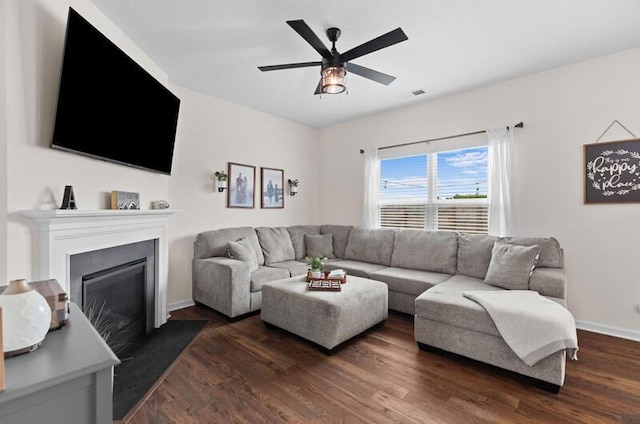 525 Cliff St, Morristown, TN 37814 - living room featuring a ceiling fan, dark wood-type flooring, a fireplace, and baseboards
