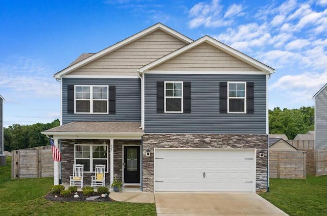 525 Cliff St, Morristown, TN 37814 - view of front of house featuring covered porch, stone siding, concrete driveway, and an attached garage