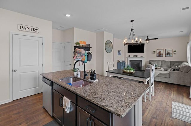 525 Cliff St, Morristown, TN 37814 - kitchen with a sink, stainless steel dishwasher, dark wood finished floors, open floor plan, and light stone countertops