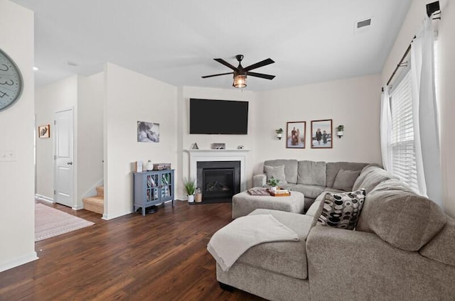 525 Cliff St, Morristown, TN 37814 - living area featuring a ceiling fan, wood finished floors, a fireplace with flush hearth, and baseboards