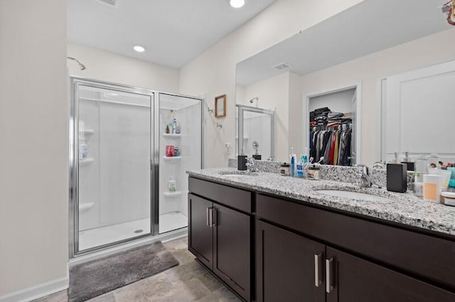 525 Cliff St, Morristown, TN 37814 - bathroom with a shower stall, double vanity, and a walk in closet