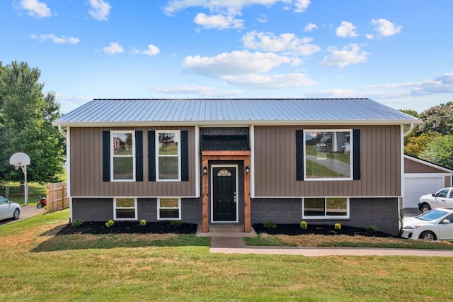 raised ranch with a front yard