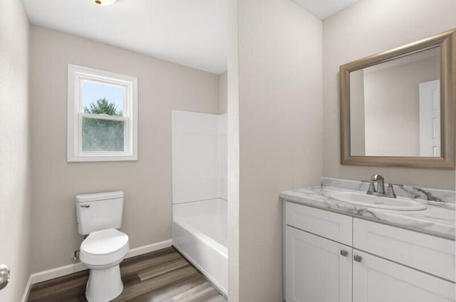 full bathroom featuring shower / bath combination, vanity, wood-type flooring, and toilet