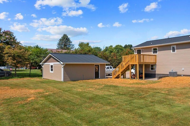 view of yard with cooling unit and a wooden deck