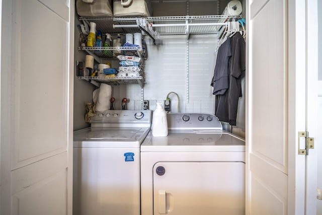 laundry room with separate washer and dryer