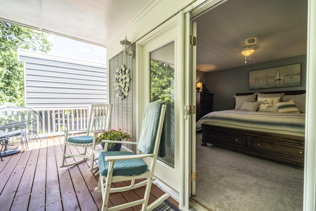 bedroom featuring hardwood / wood-style flooring and multiple windows