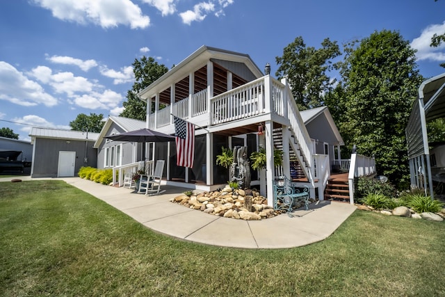 view of front facade featuring a deck and a front yard