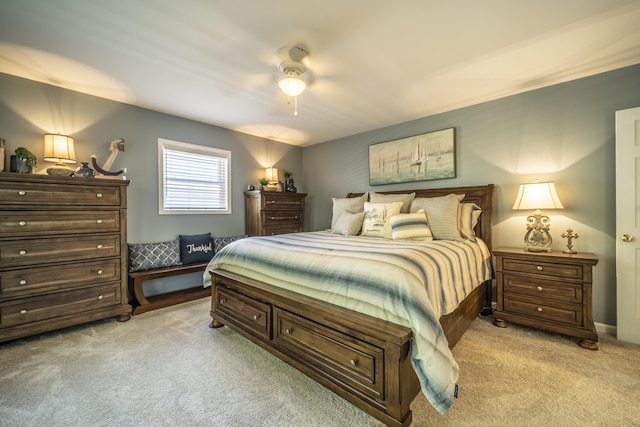 bedroom featuring ceiling fan and light carpet